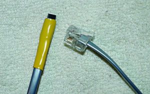 Abbildung 5: Der fertige Sensor in dem zusammengeschrumpften Schlauchstück.